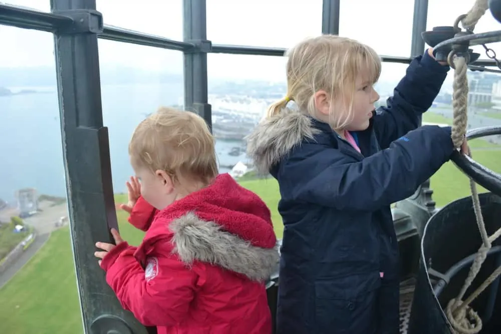 Children in lantern room in lighthouse in Plymouth