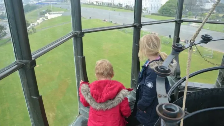 Children in lantern room in lighthouse in Plymouth