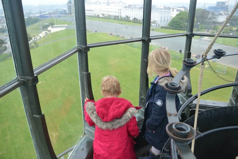 Children in lantern room in lighthouse in Plymouth