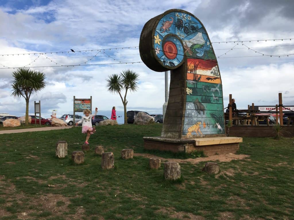 Colourful feature showing periods of time at Geoplay Park in Paignton, Devon