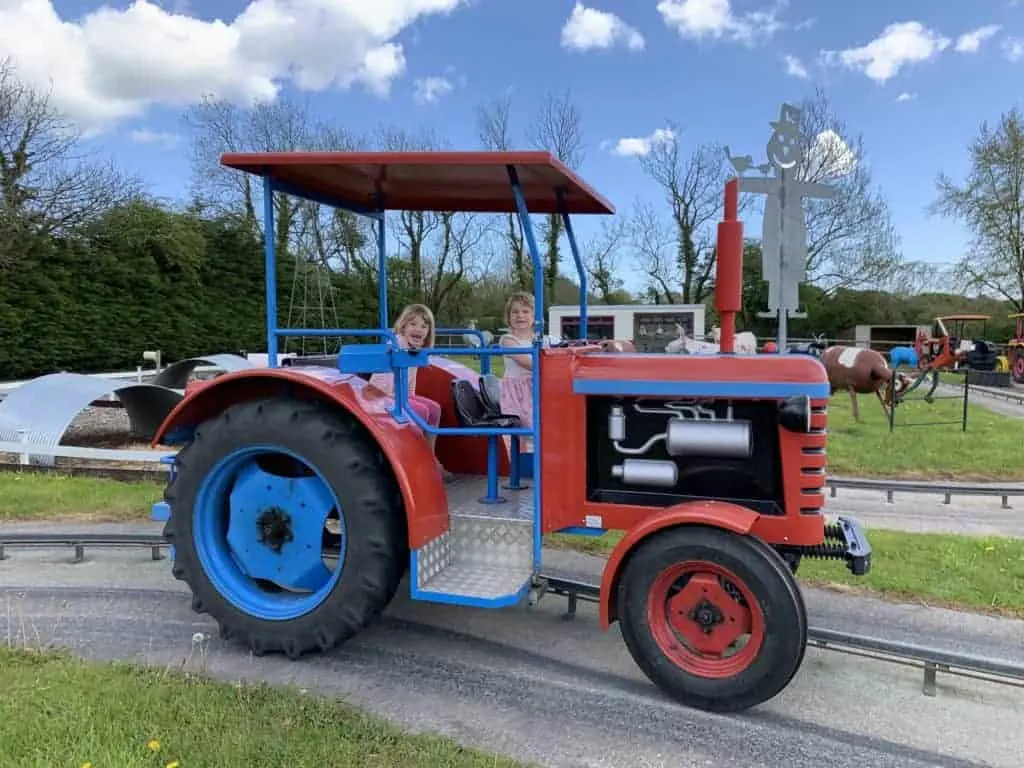 Kids on tractor ride at Woodlands theme park in Devon