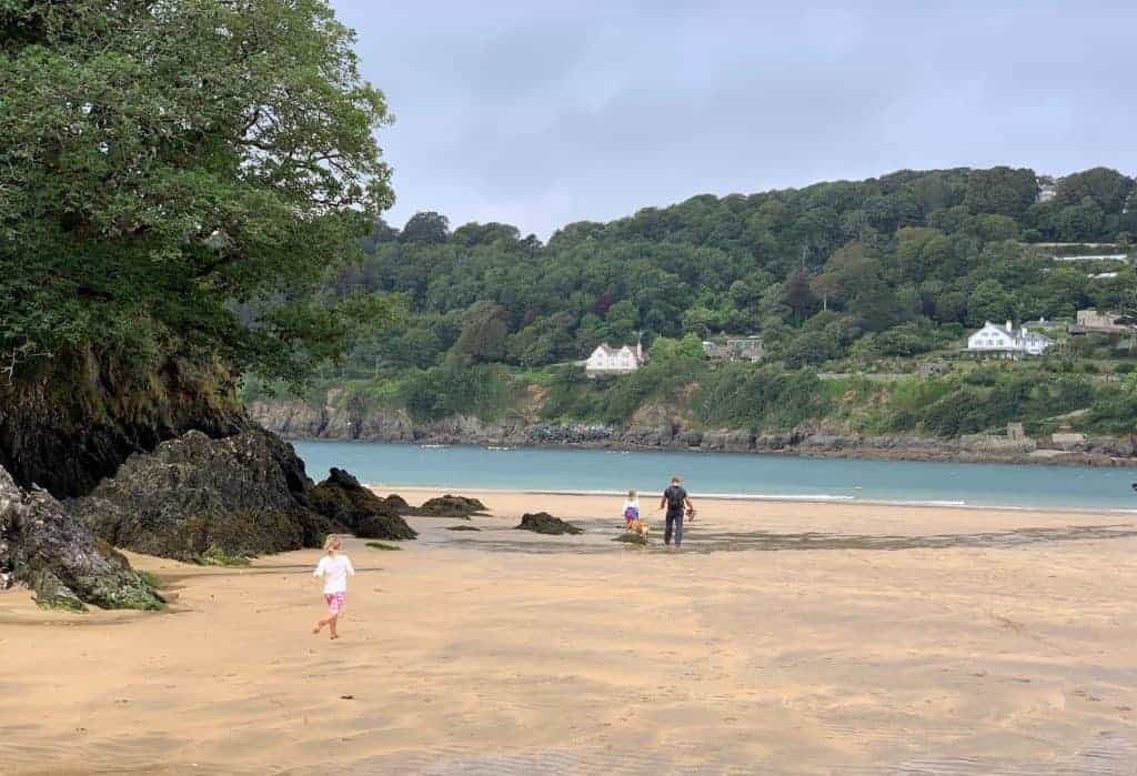 Family on sandy beach at Mill Bay near Kingsbridge in South Devon