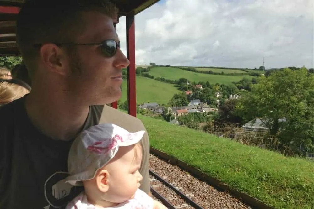 Father and baby on Pecorama Beer Heights Light Railway in Beer
