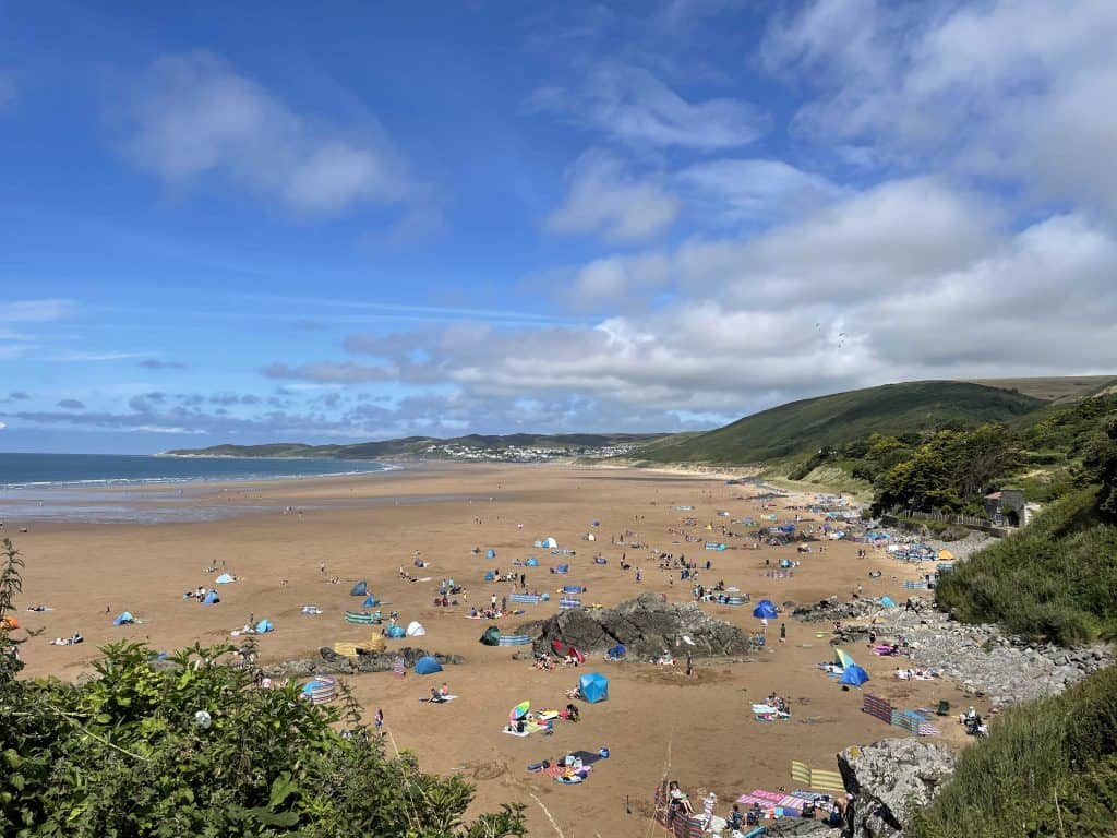 Families enjoying Putsborough Sands beach in North Devon