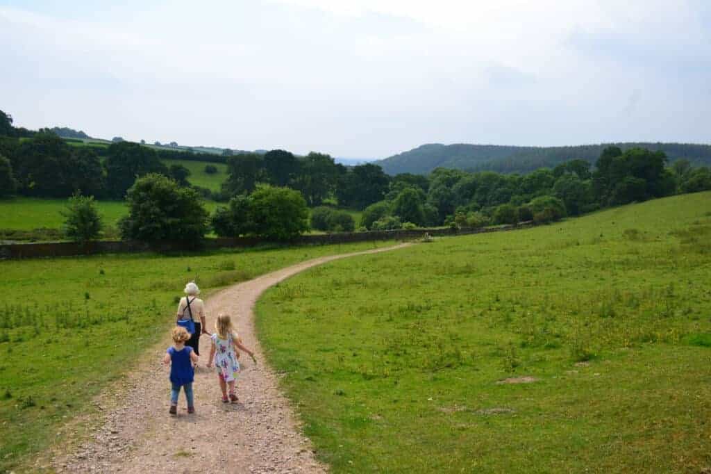 Family walking at trail at Buckland Abbey estate on Dartmoor