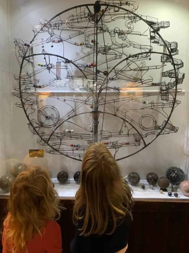 Children looking at marble run