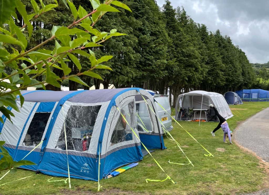 Camper van and awning on pitch at California Cross campsite