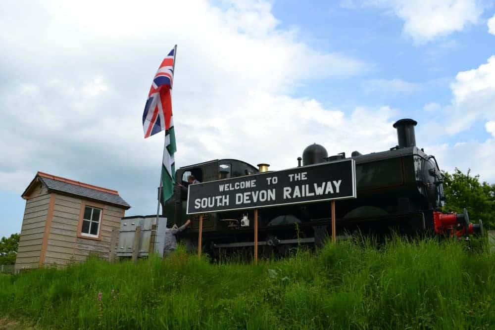 Welcome sign and stream train at South Devon Railway in Dartmoor, Devon