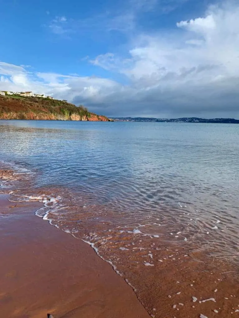 Red sand of beach in Paignton, Devon in winter
