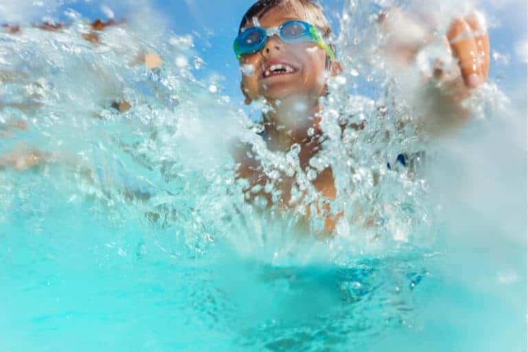 Boy splashing in water