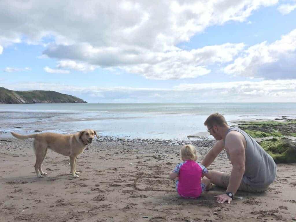 Family sitting on Mansands Beach 