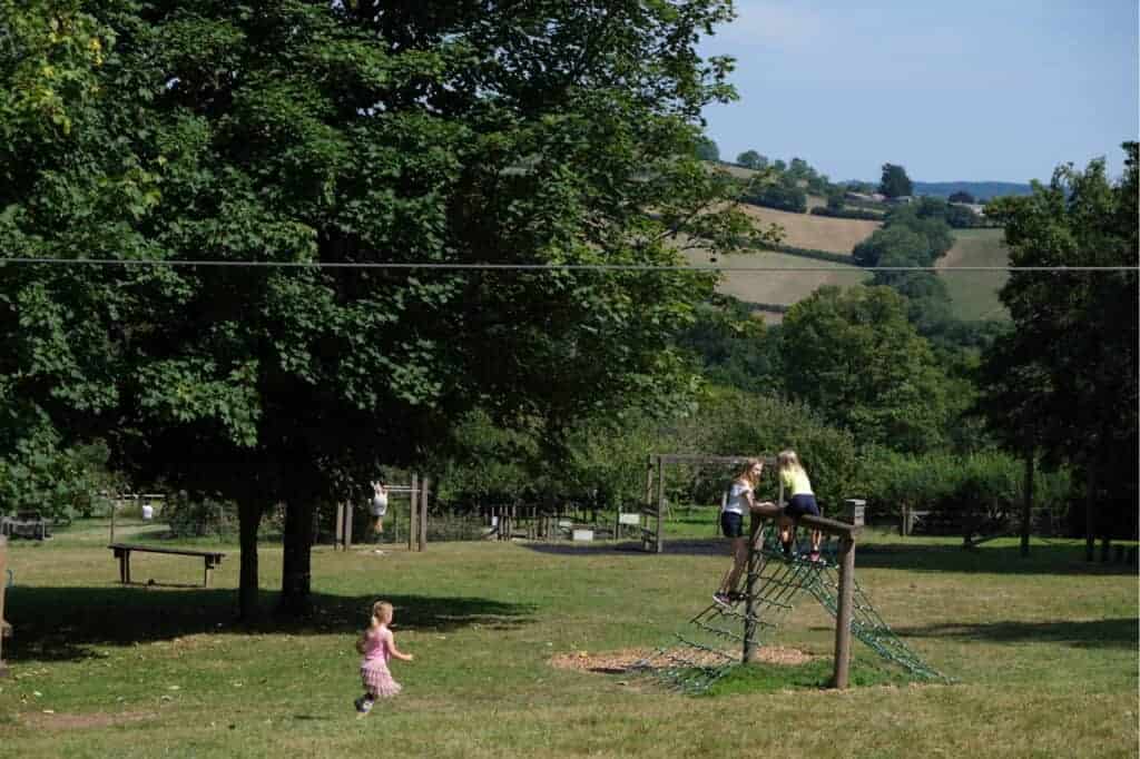 Children playing on mini assault course