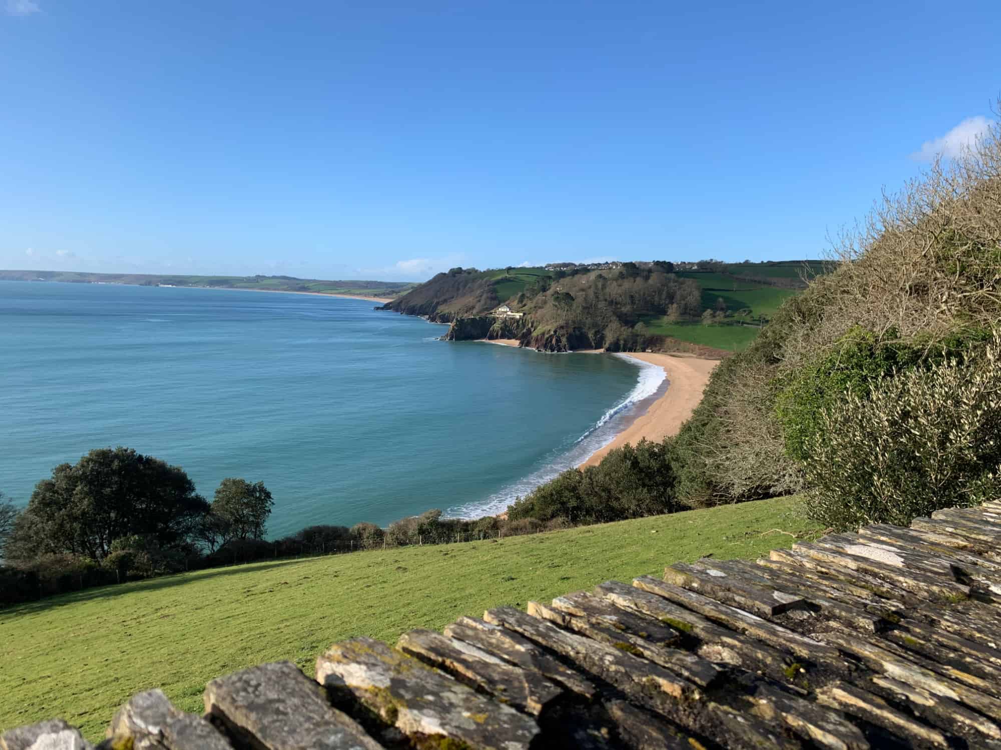 View of Blackpool Sands and Start Bay from road above