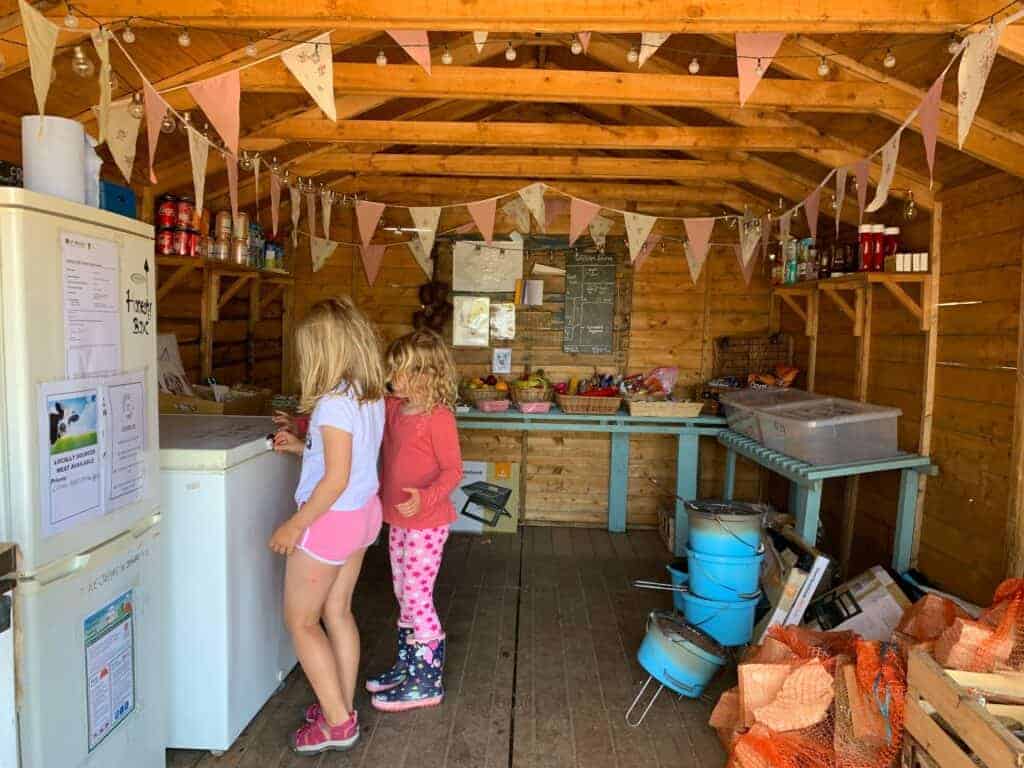 Children in honesty shop at Wilton Farm