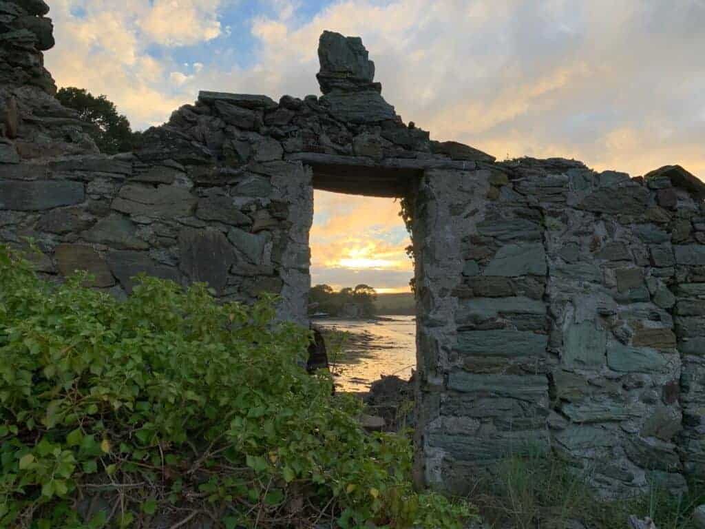 Sun set view through window of ruined building