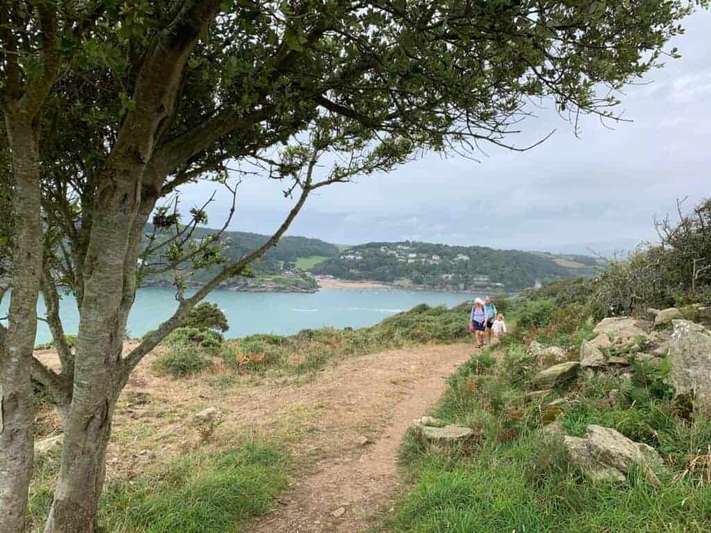 Family walking along South West Coast Path by Rickman Common