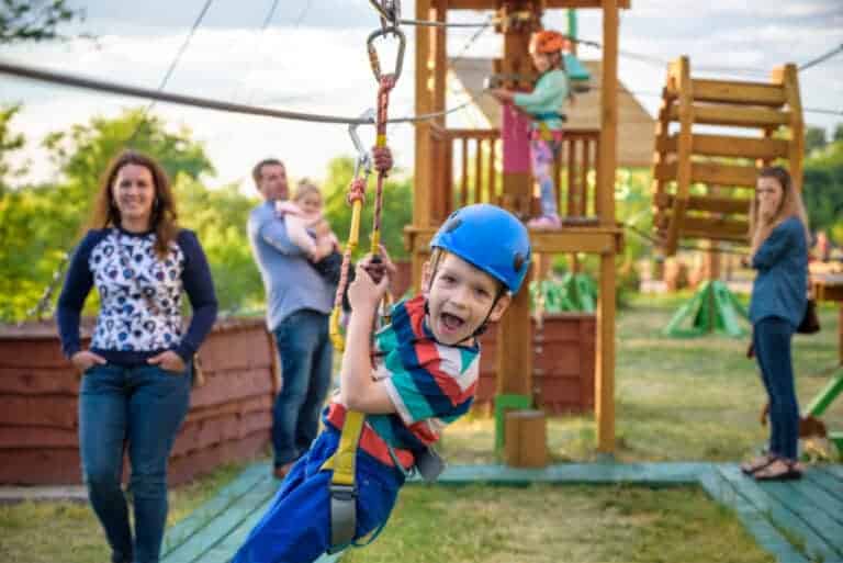Boy on zip wire at adventure playground
