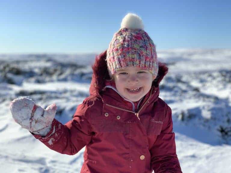Child dressed for a snow day on Dartmoor