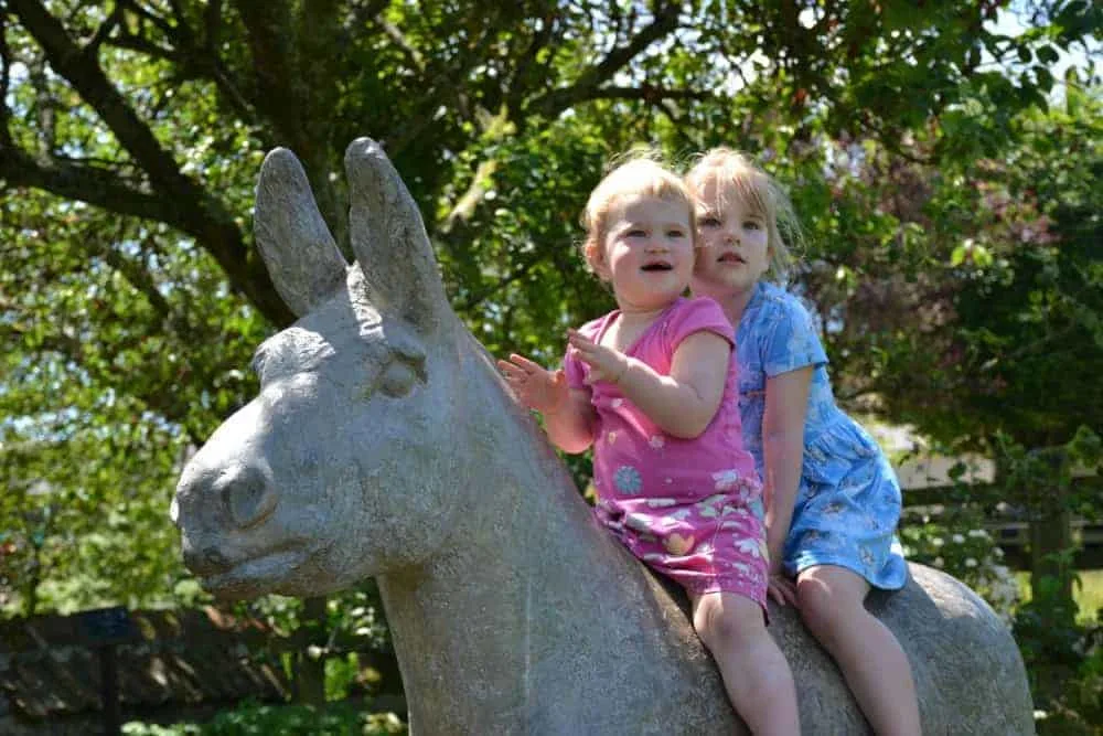 Girls on donkey sculpture
