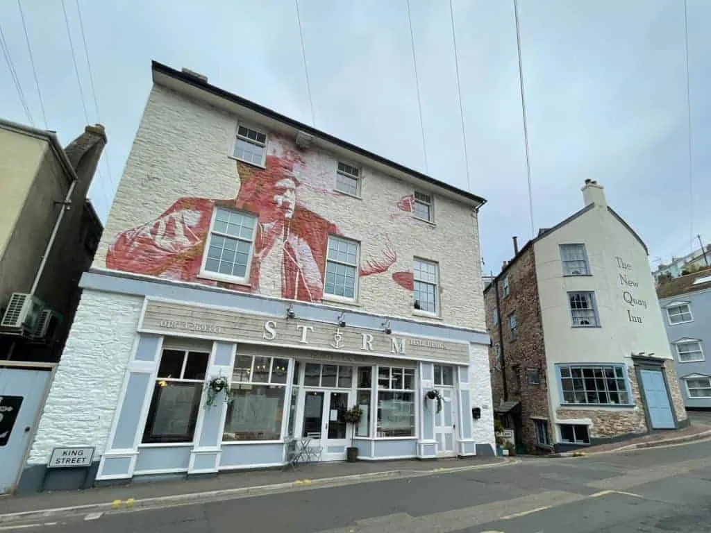 Street art on the side of Storm restaurant building in Brixham