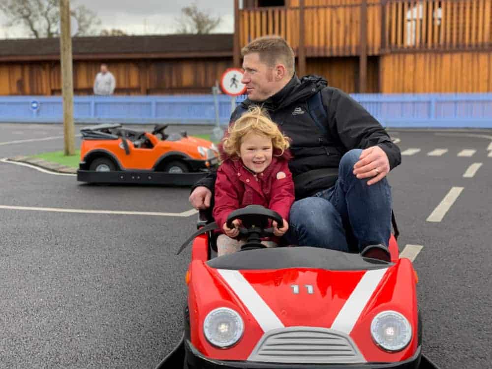 Father and child in Driving School car at Crealy