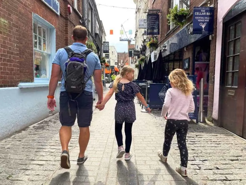 Family walking down Gandy Street in Exeter
