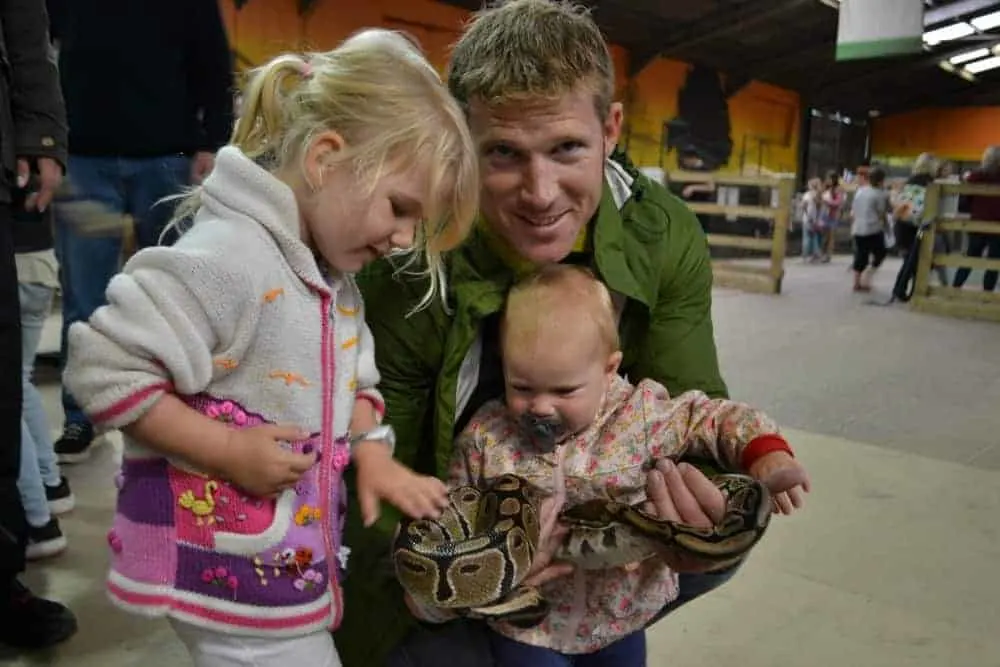 Girls holding snake in Animal Kingdom
