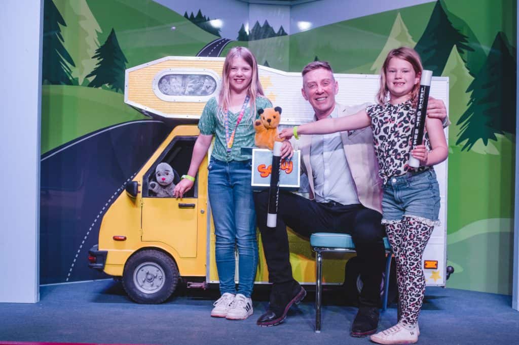 Children meet Sooty and TV presenter Richard Cardell