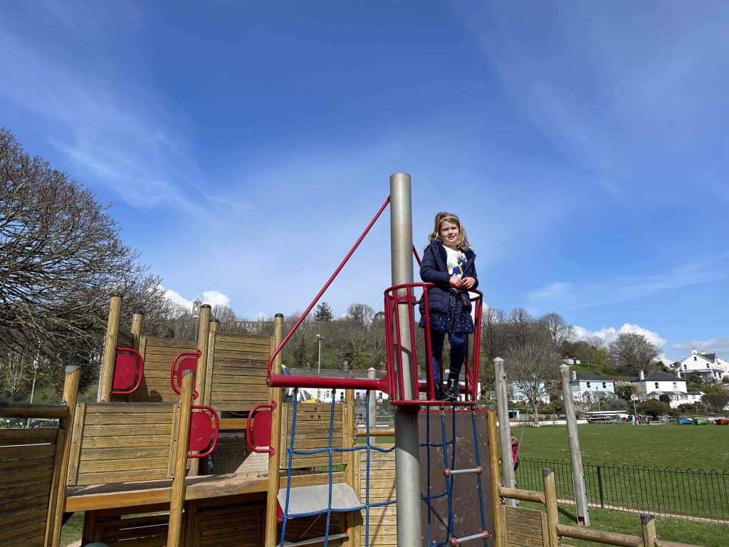 Child at the top of playground at Coronation Park in Dartmouth