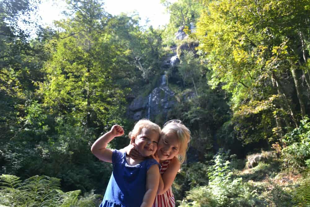 Children stood in front of Canonteign Falls on woods