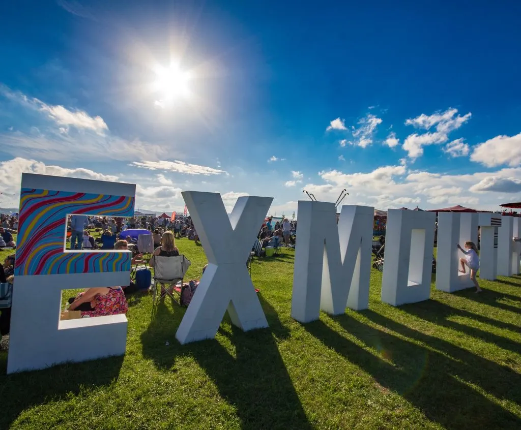 Huge Exmouth sign on grass at festival