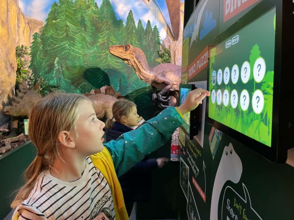 Children playing with touch screen games in Torquay Dinosaur World