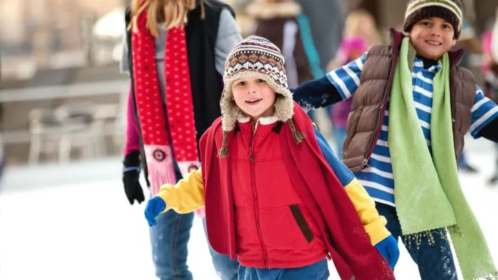 a family spends the day ice-skating outdoors