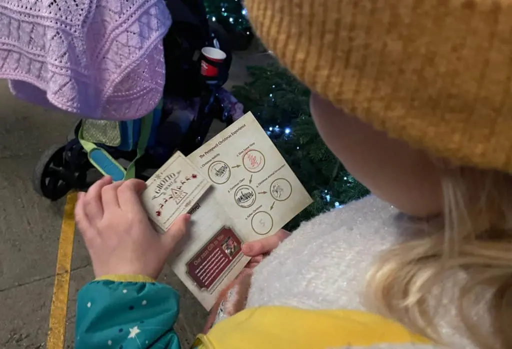 Child looking at Pennywell Farm's Christmas passport