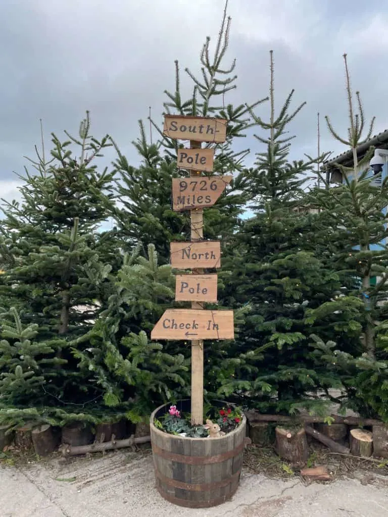 Wooden sign with directions to the South Pole