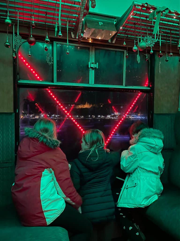 Children looking out of Train. of Lights carriage window at a view of Dartmouth