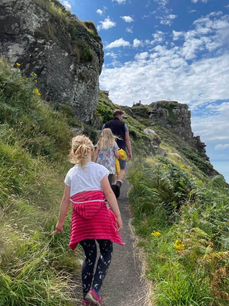 Family walking on South West Coast Path at Valley of Rocks