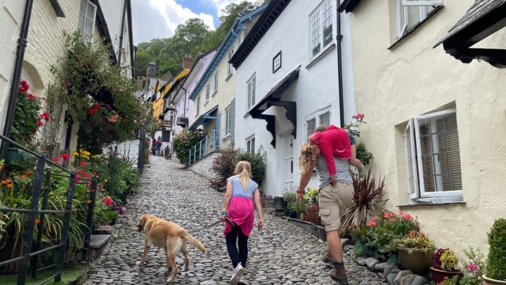 Family walking up Clovelly street