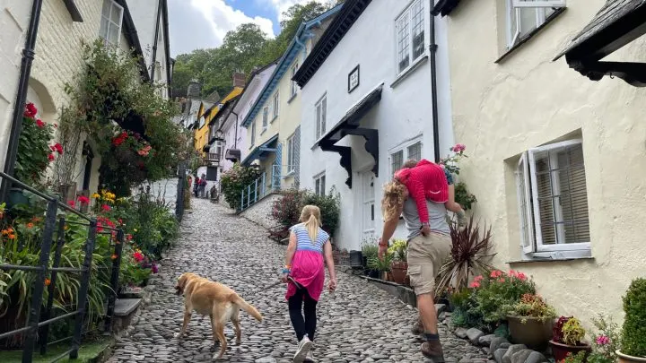 Family walking up Clovelly street