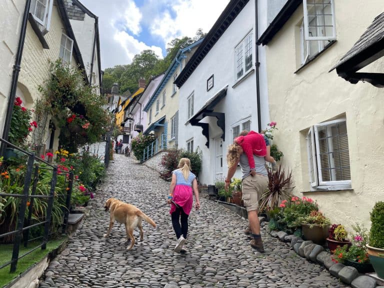 Family walking up Clovelly street