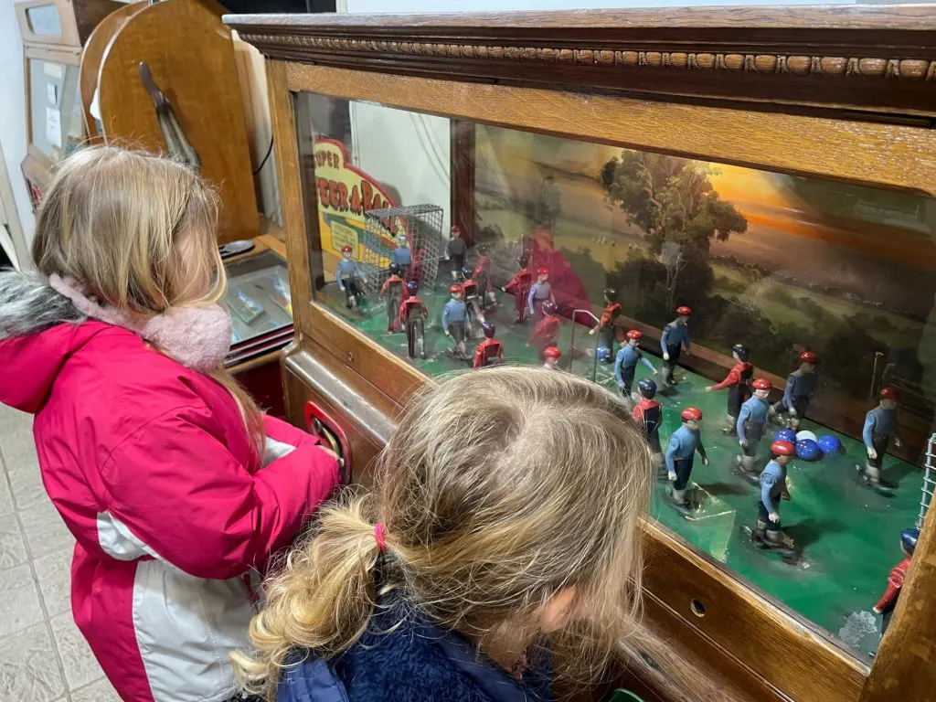 Children playing old fashioned amusement game
