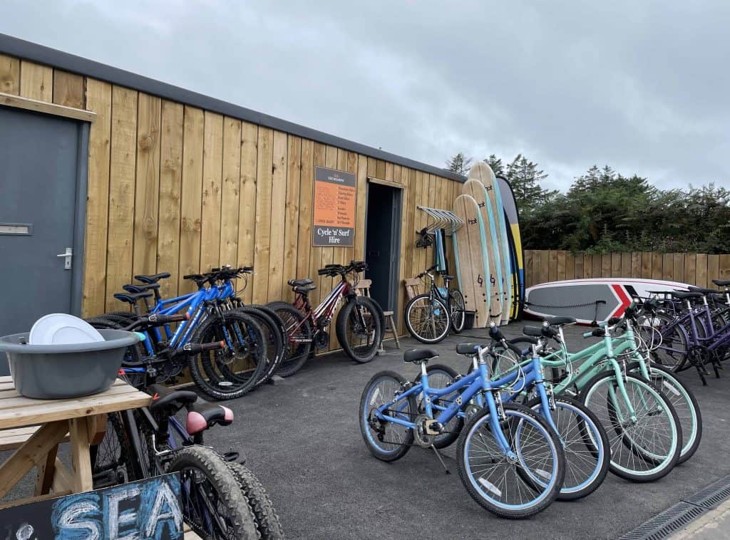 Bikes lined up outside wooden hut