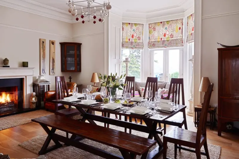 Elegant dining room with table set for dinner