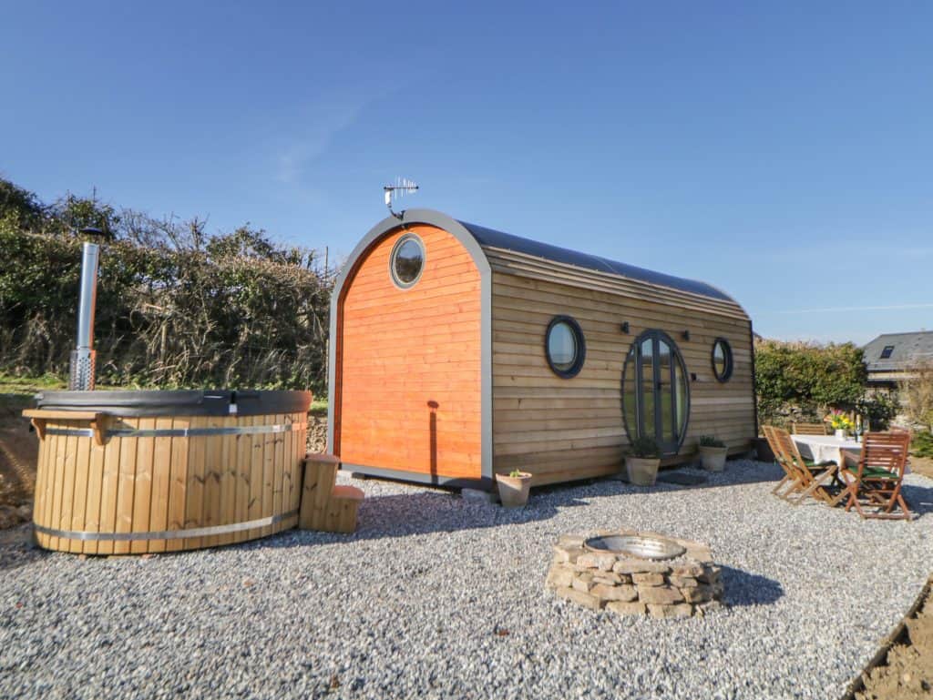 Wooden shepherds hut with hot tub