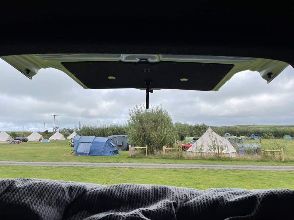 View of campsite out of back of camper van