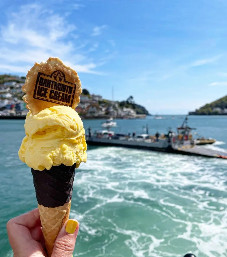 View of Dartmouth Lower Ferry on the River Dart with an ice cream in the foreground