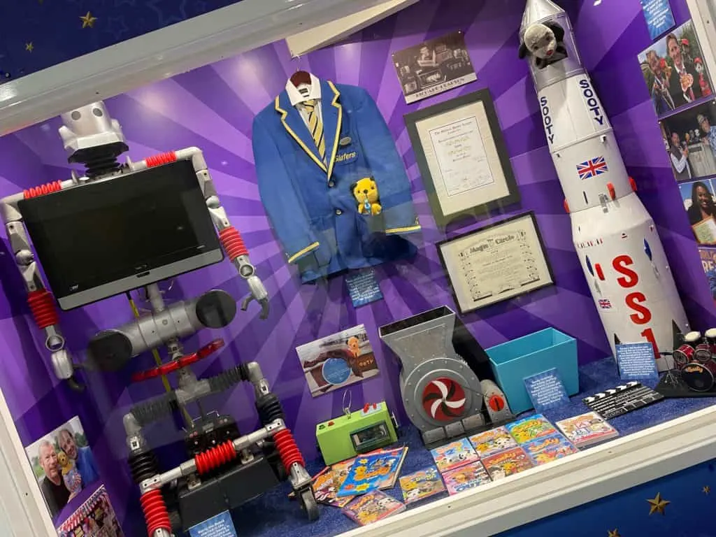 Display cabinet containing TV show props and memorabilia from the Sooty Show