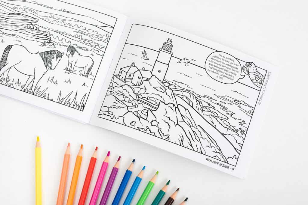 Pages of the South Hams Colouring Book for Kids with pencils fanned out below
