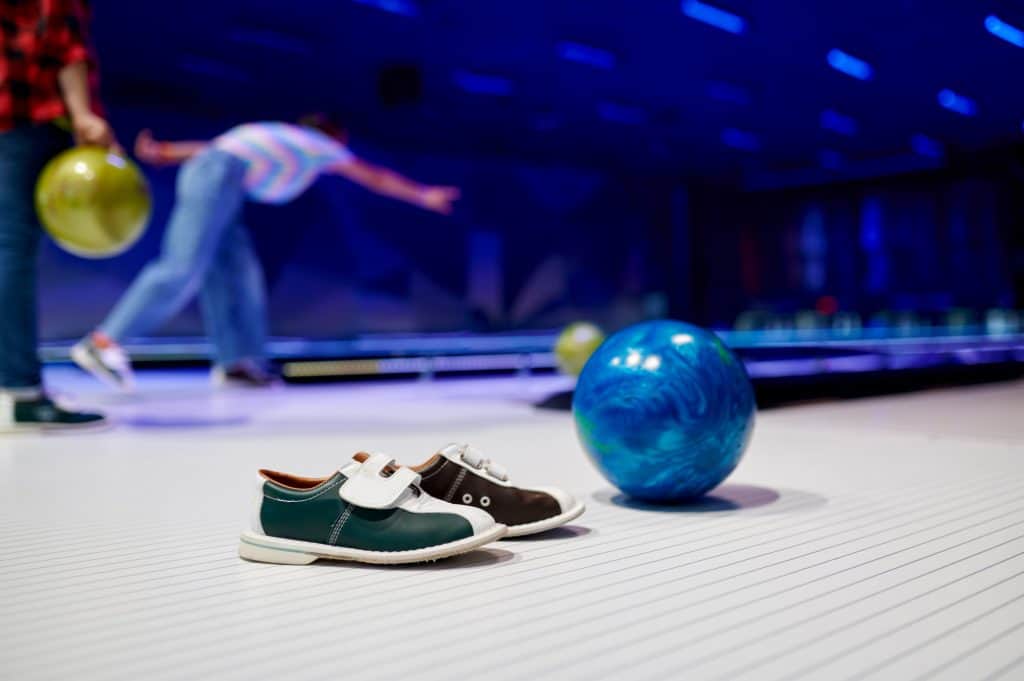 Bowling ball and shoes in bowling alley
