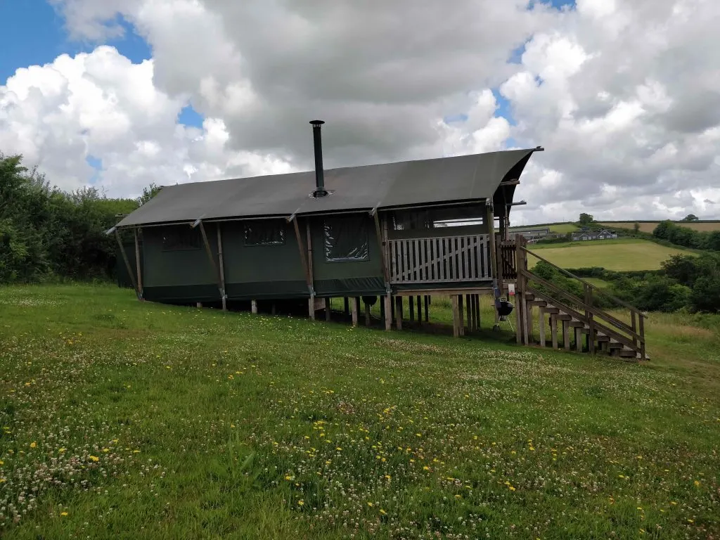 Glow Worm safari tent in field at Brackenhill Glamping